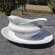 Vintage fine porcelain sauce boat with gold gilding.