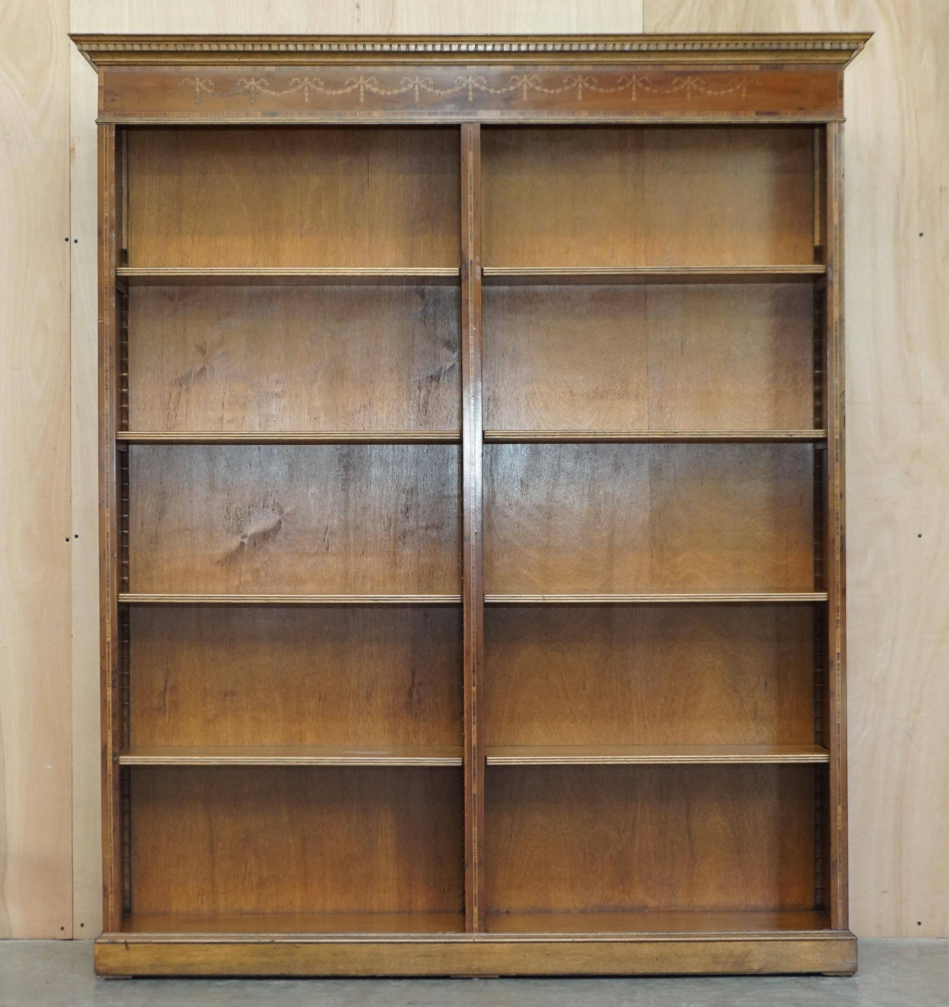 Pair of Sheraton Revival bookcases in satinwood, walnut, and yew.