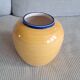 Ceramic vase in a round shape