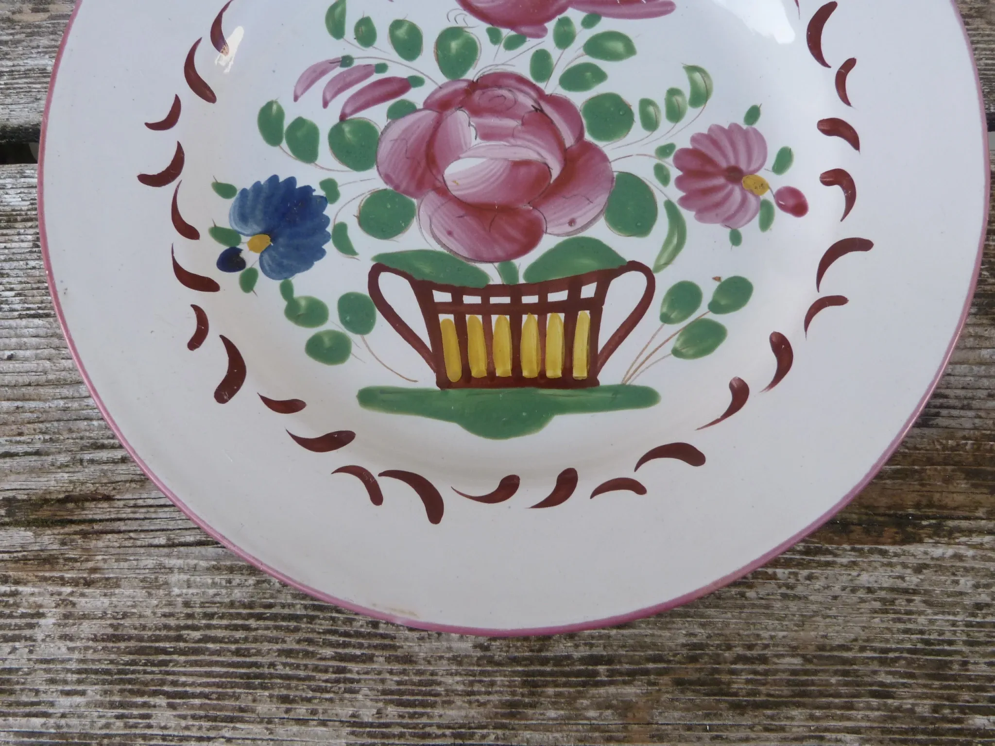 Old St Clément earthenware plate, flat plate with flower patterns.