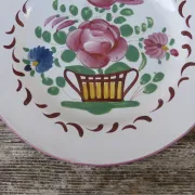 Old St Clément earthenware plate, flat plate with flower patterns.