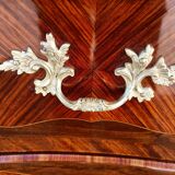 Louis XV jumping chest of drawers curved in precious wood marquetry.