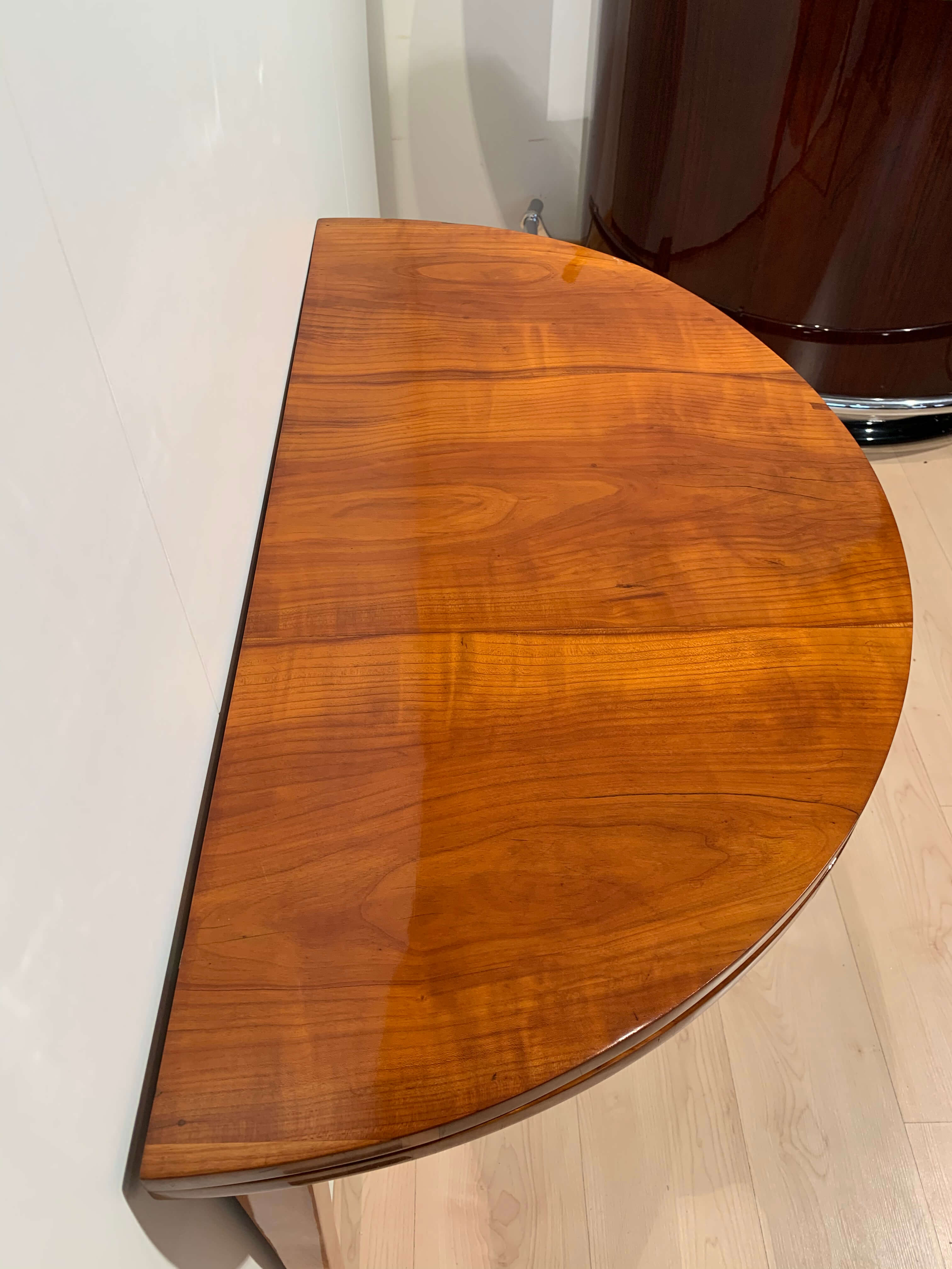 Biedermeier demi-lune fold-out table, cherry veneer, south germany, circa 1820
