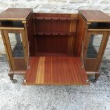 Bar cabinet on casters in walnut