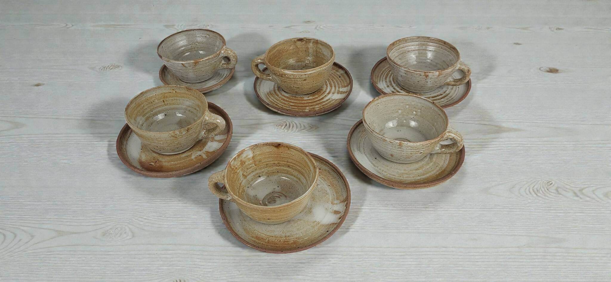 6 stoneware cups and saucers by Pierre Lion