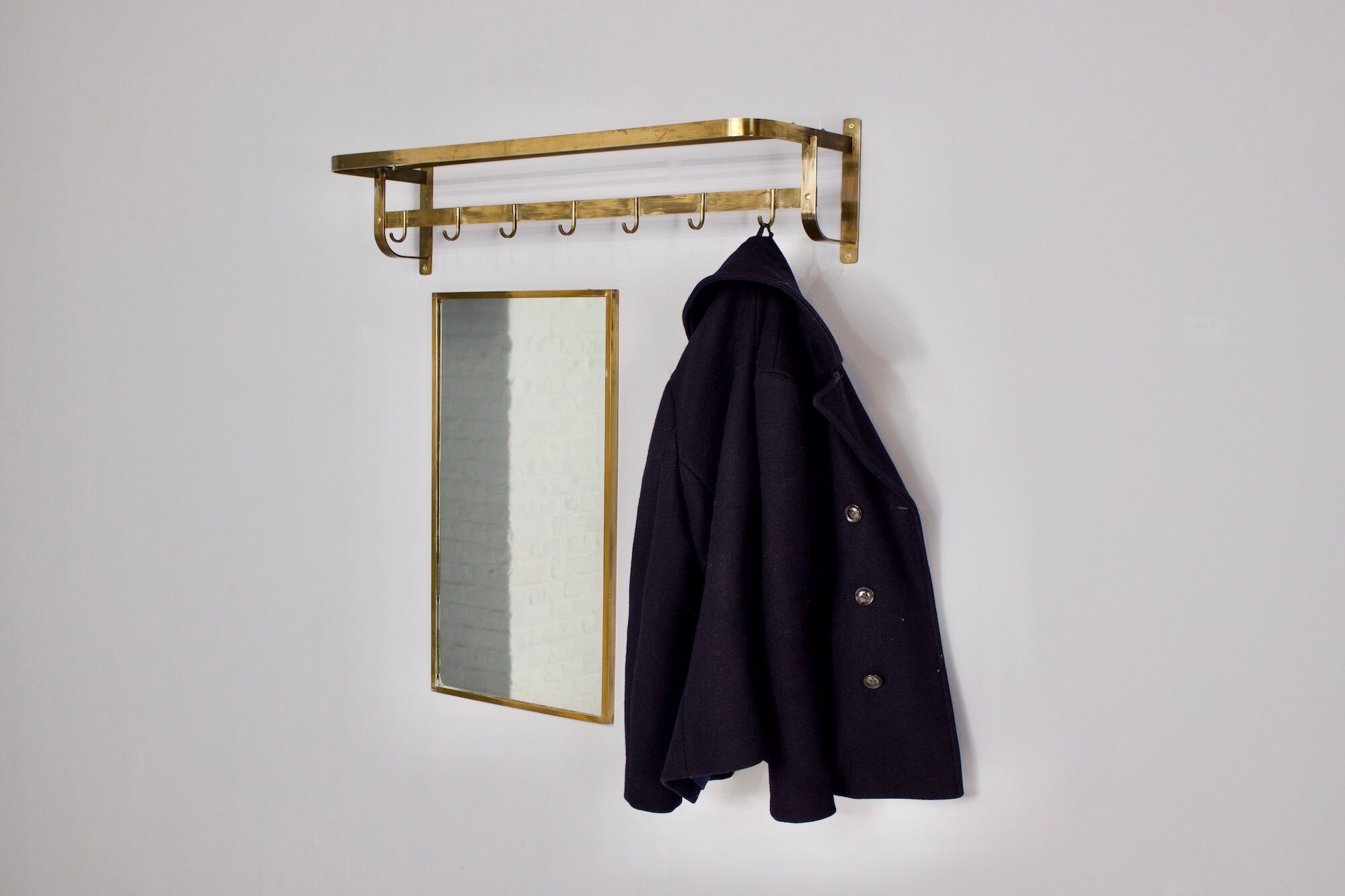 Vereinigte Werkstätten, brass cloakroom and mirror