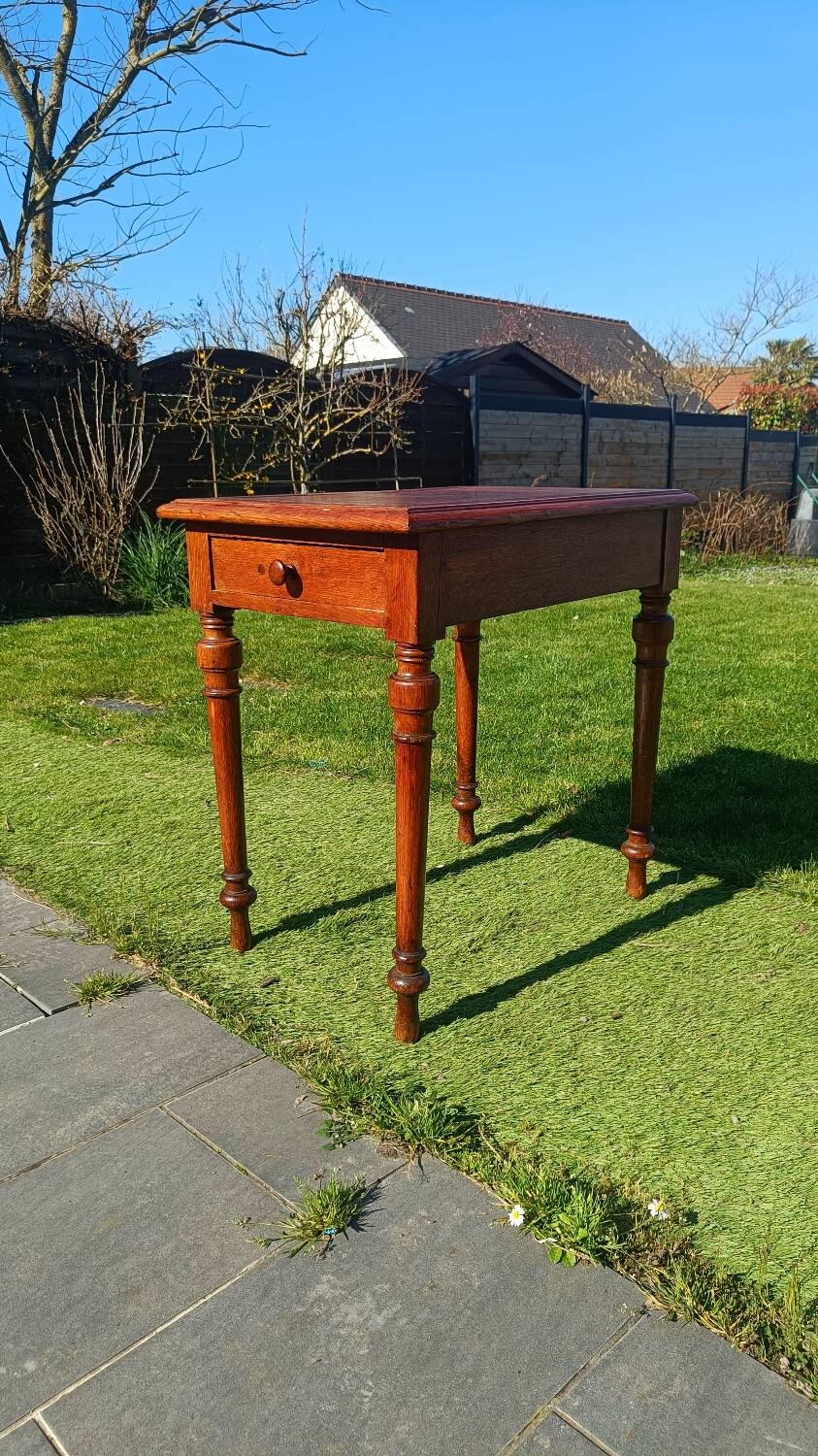 Antique solid wood table with a through drawer.