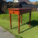 Antique solid wood table with a through drawer.
