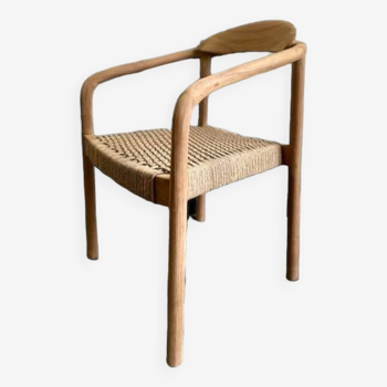 Solid wood chair with weaved seat and armrests