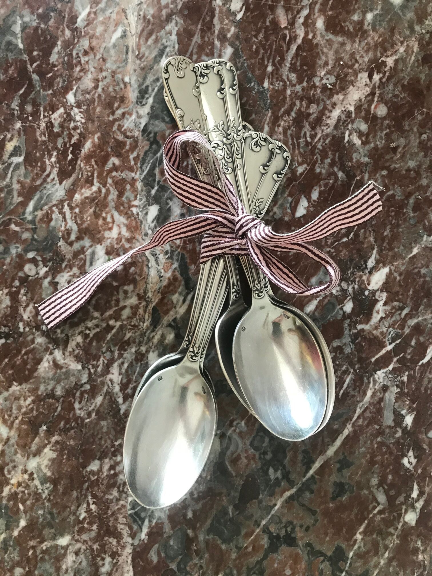 Set of 7 tablespoons in flowered silver metal with punch