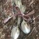 Set of 7 tablespoons in flowered silver metal with punch