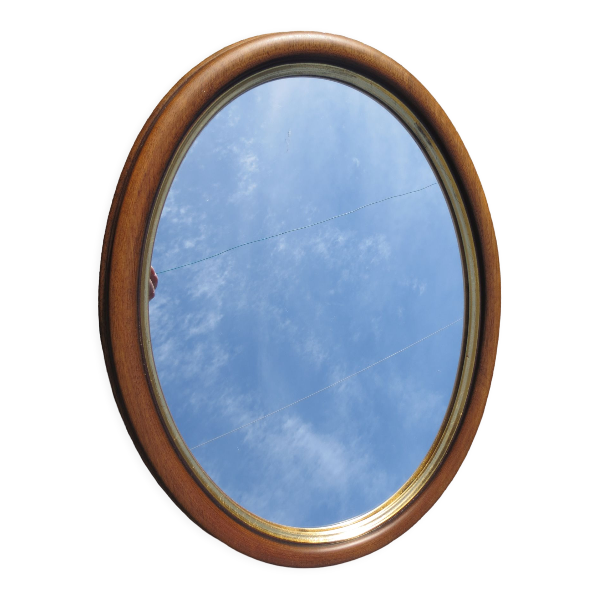 Old oval mirror, walnut wood tower, gilded border