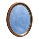 Old oval mirror, walnut wood tower, gilded border