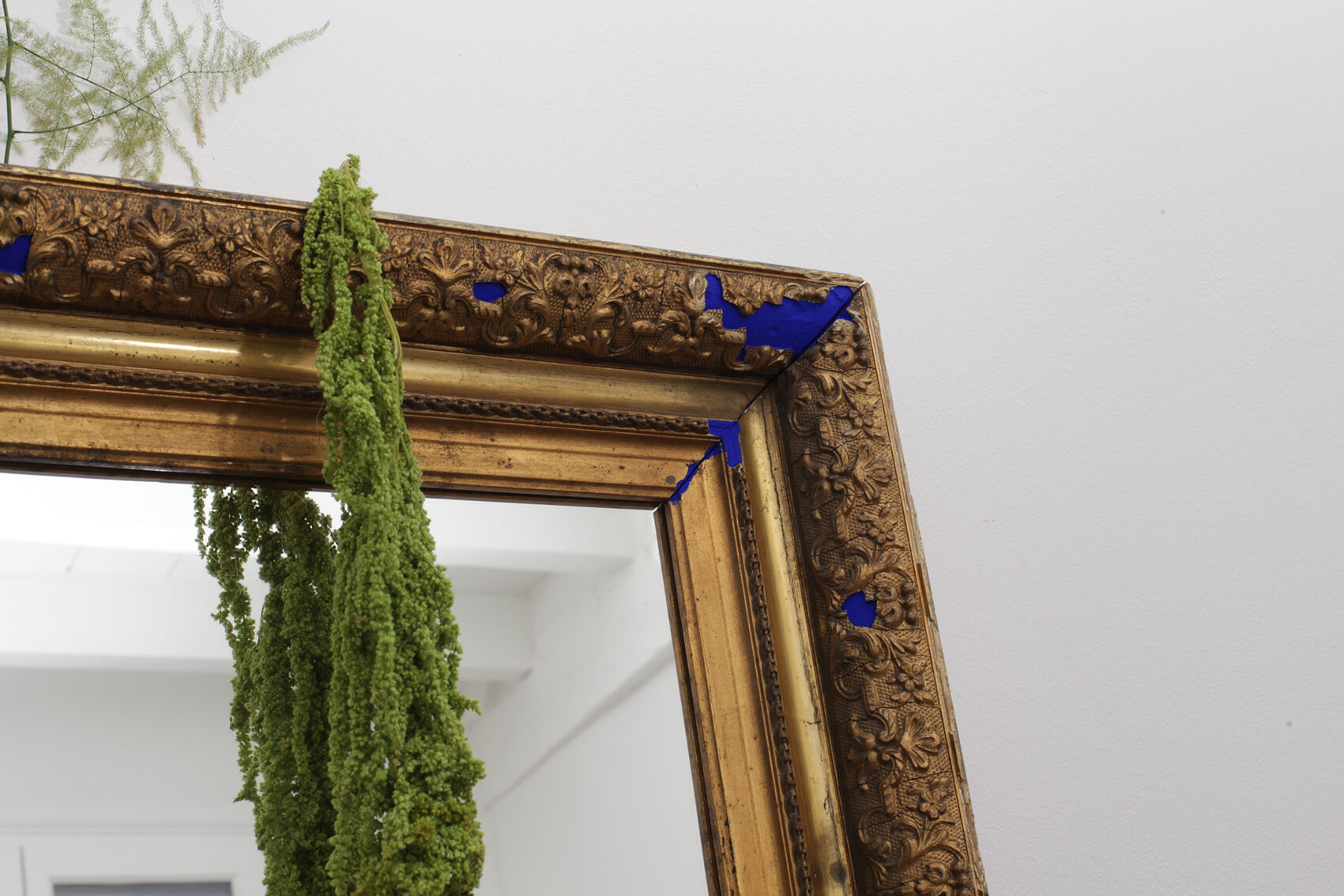 Golden antique mirror with leaf and bright king blue