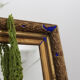 Golden antique mirror with leaf and bright king blue