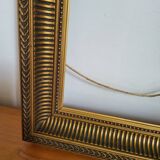 Frame with channels in wood and gilded stucco