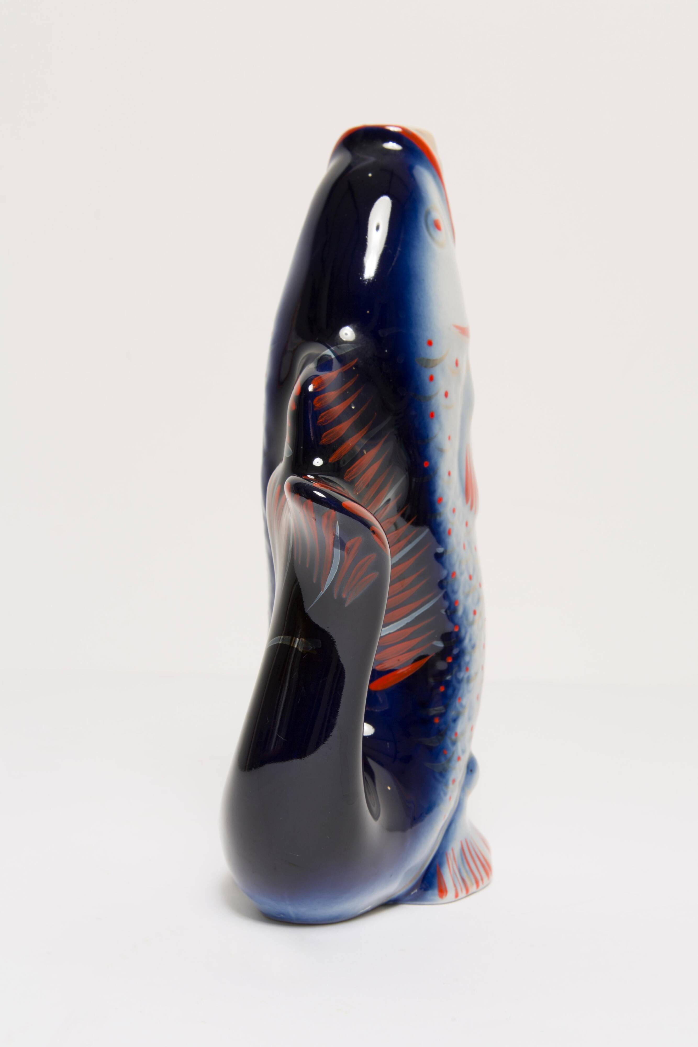 Set of 7 blue glass fish, mid-20th century.