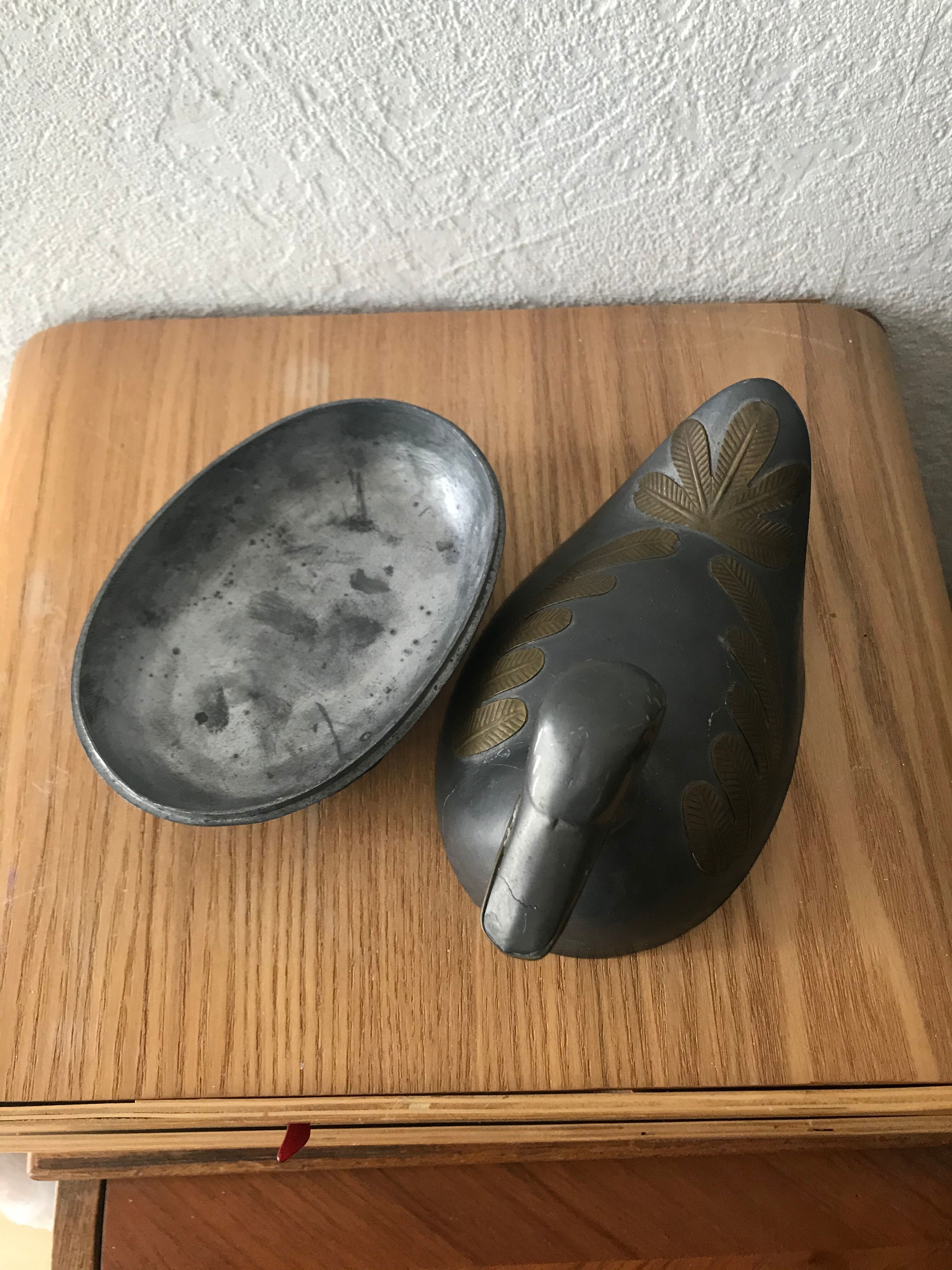 Tin duck box and brass