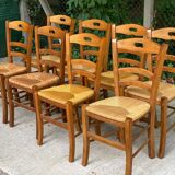 12 solid wood and straw chairs