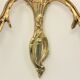 Pair of louis XV beveled mirror wall lamps in bronze by "Lucien Gau"