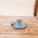 Blue enameled sheet metal candle holder