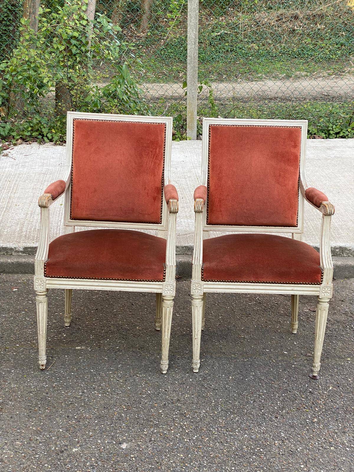 2 Louis XVI armchairs in solid wood and orange velvet.