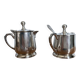 Two small silver-plated metal tea service pots from the 20th century.