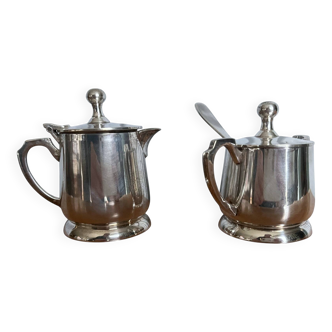 Two small silver-plated metal tea service pots from the 20th century.