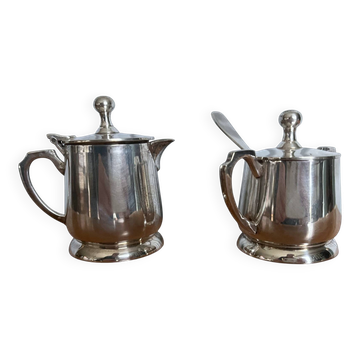 Two small silver-plated metal tea service pots from the 20th century.