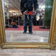 Old nineteenth century mirror in gilded wood and carved around 1850