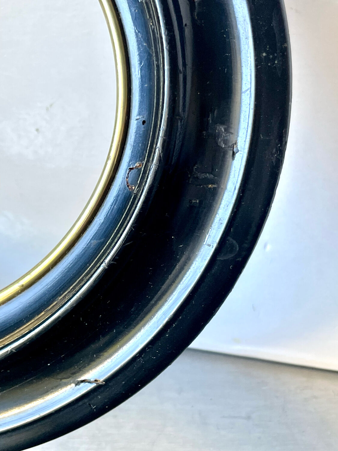 Black wooden oval frame