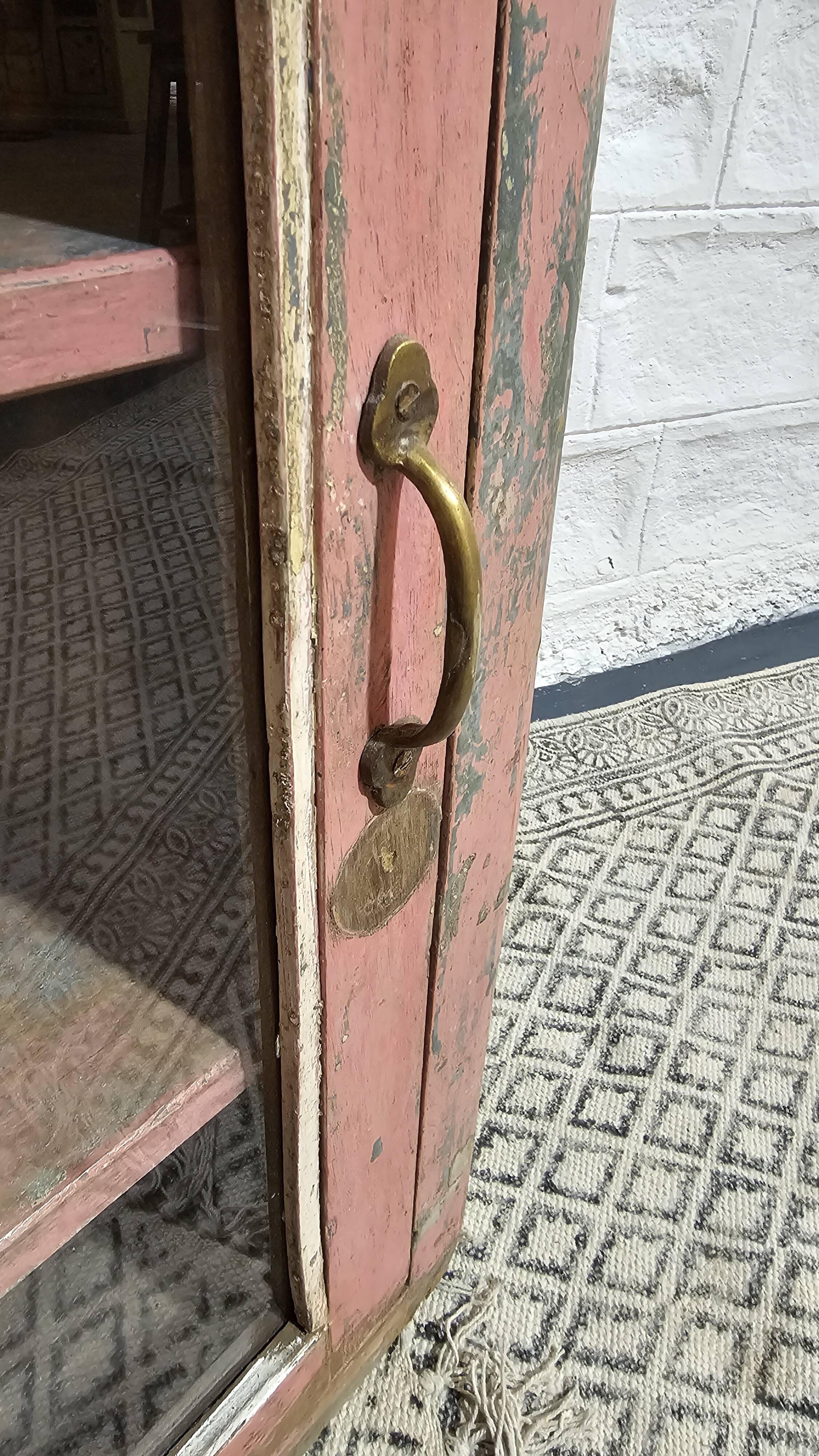 Pink showcase in Burmese teak