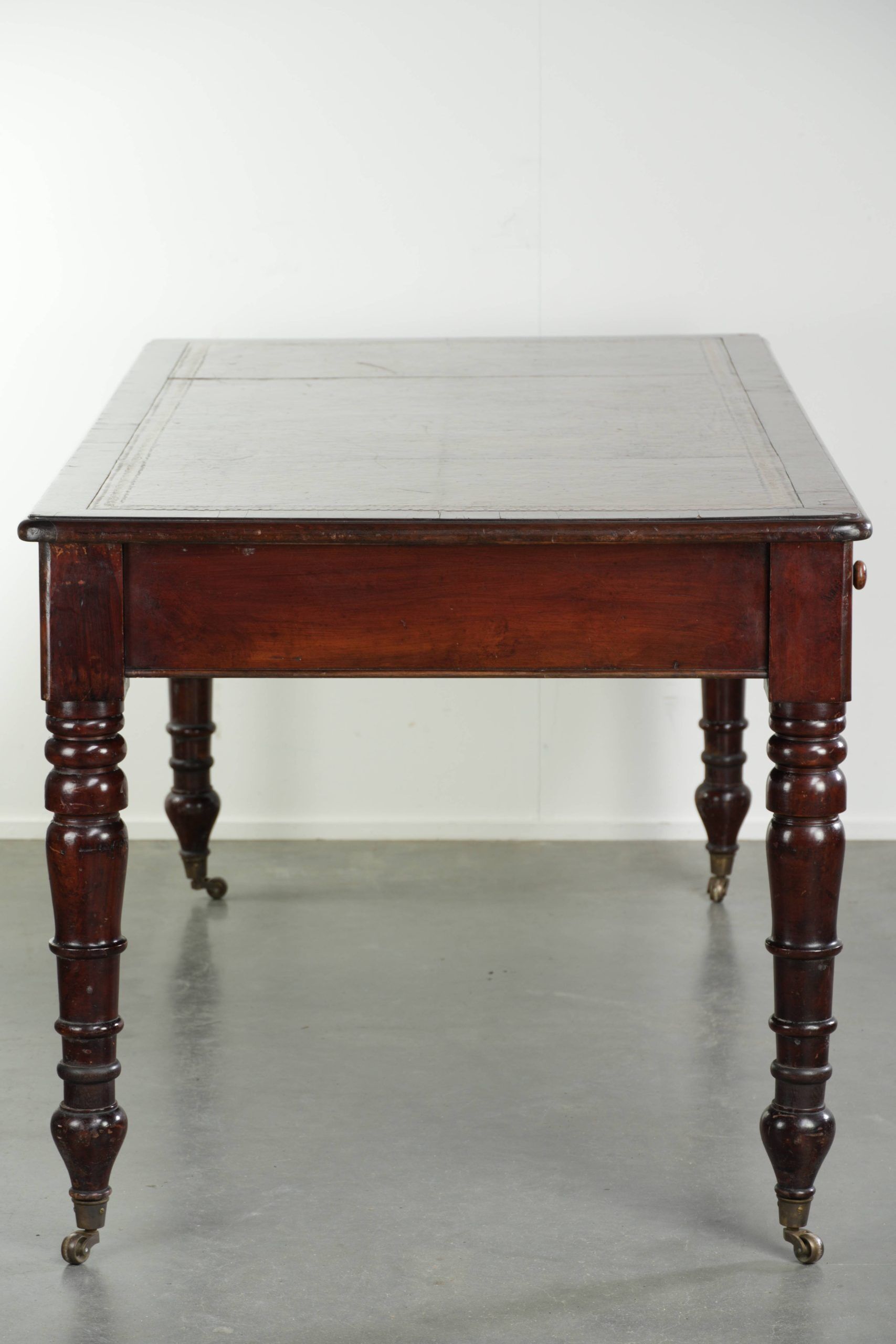 Antique English writing desk from the late 19th century with a warm colour