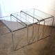 3 nesting tables in chrome metal and glass, 1970s.