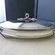 Oval-shaped covered gratin dish in Silver Metal