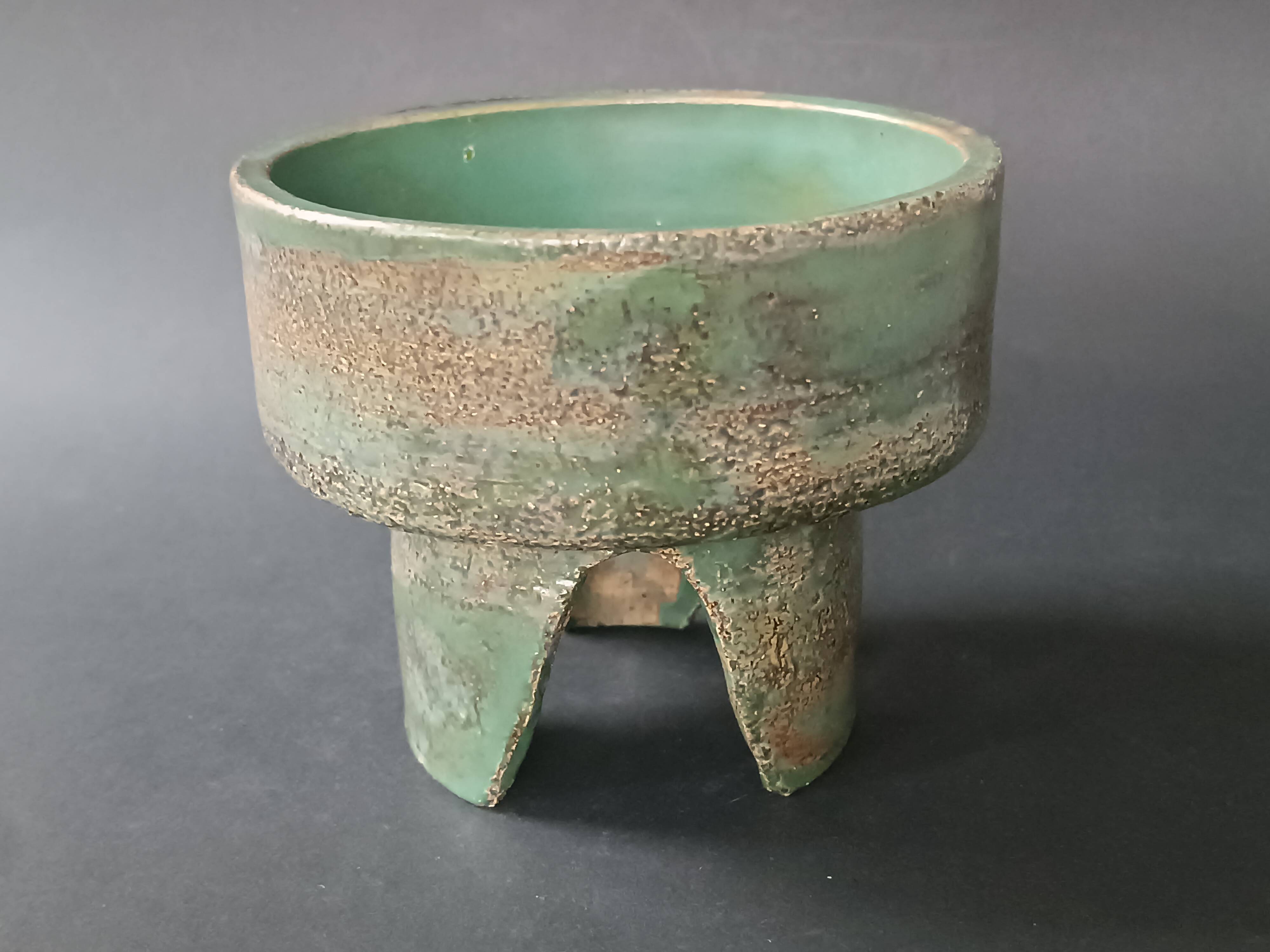 Footed dish in chamotte stoneware green with signature 1960