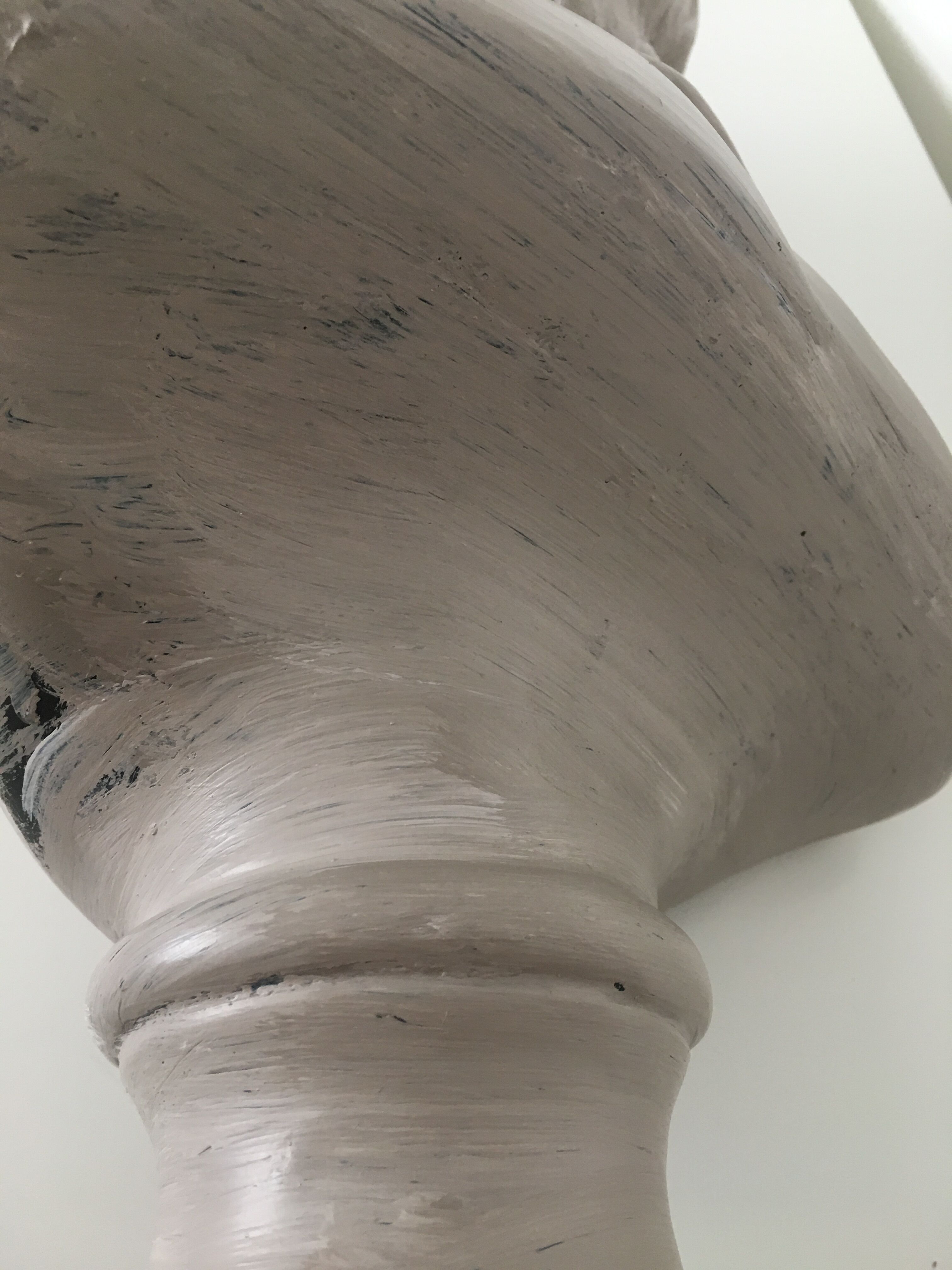 Cherub bust in platter