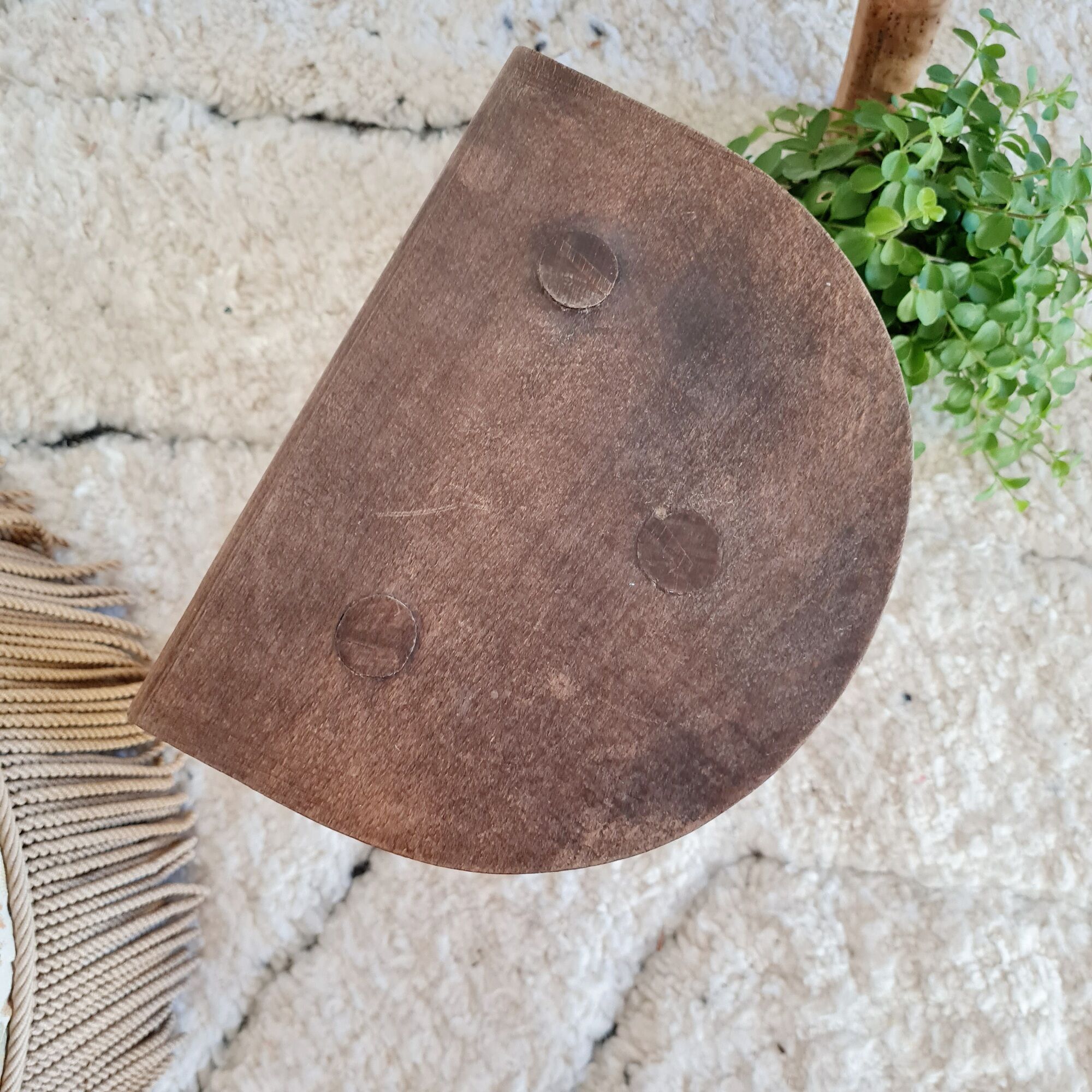 Old wooden tripod wooden farm stool made of wood