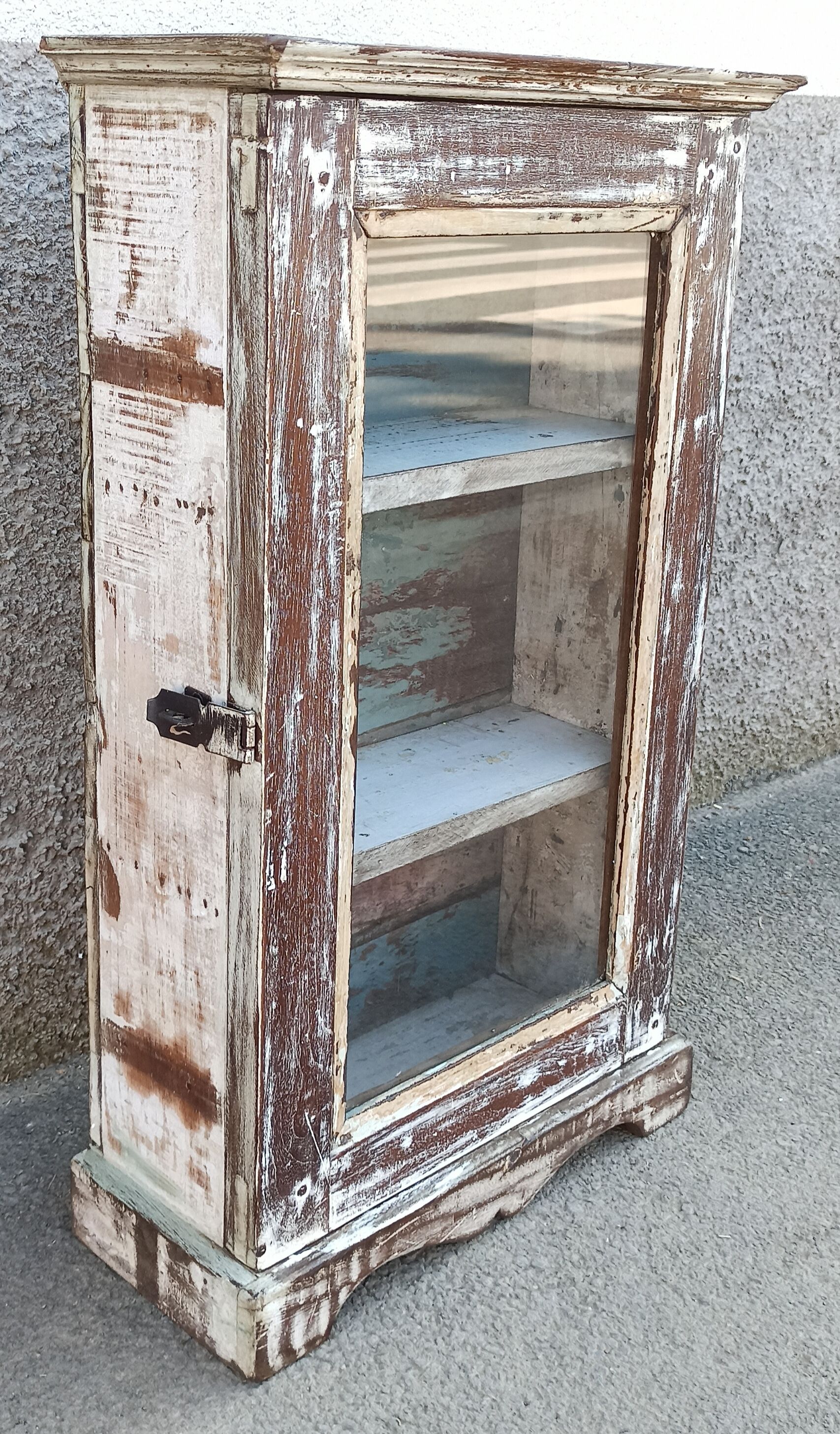 Old small wooden wardrobe with glass door