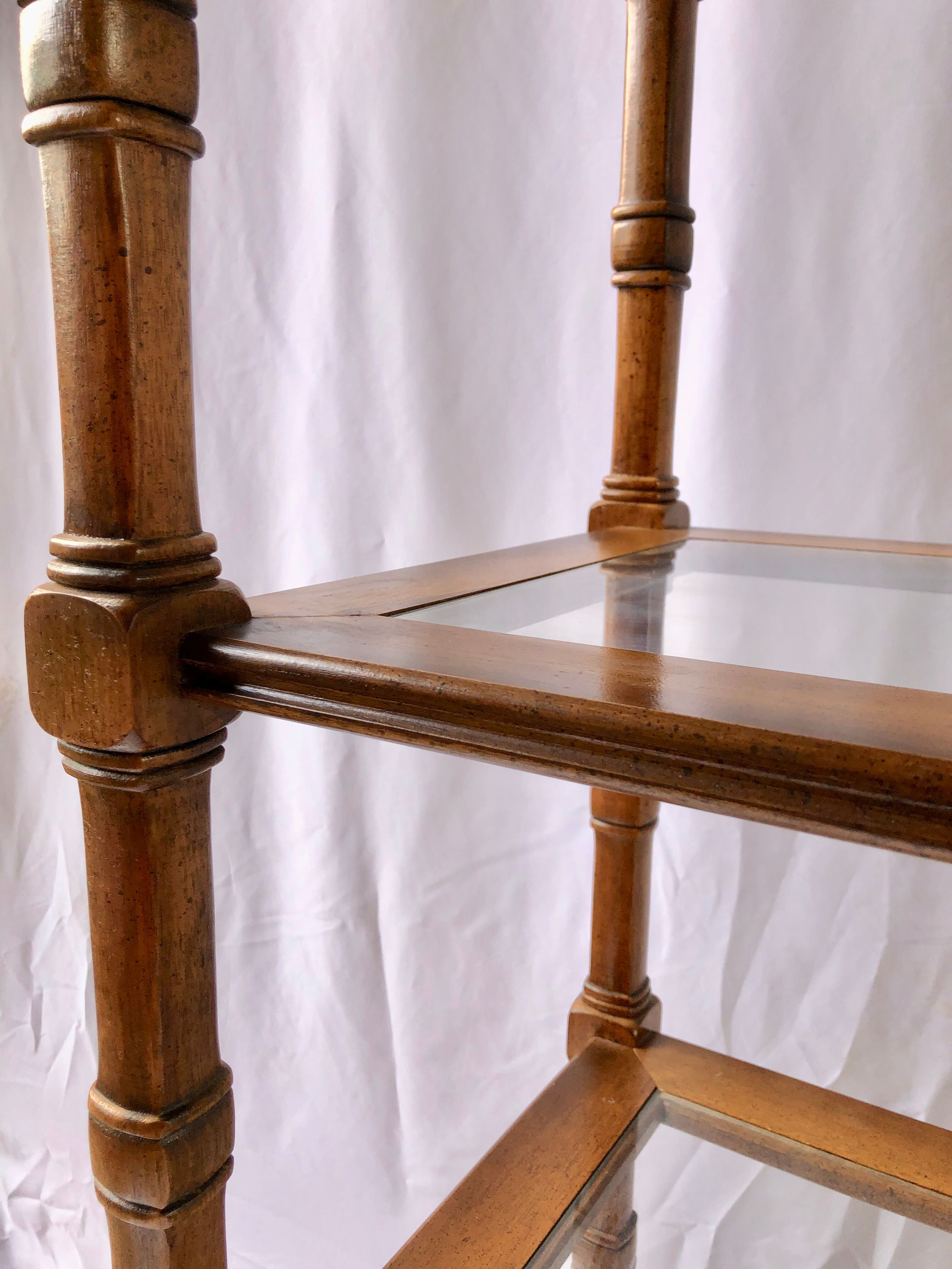 Classic wooden shelves, glass tops and cannage