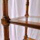 Classic wooden shelves, glass tops and cannage
