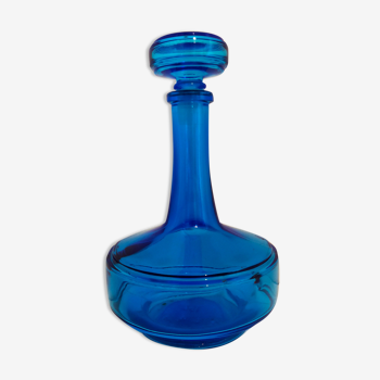 Bottle of old perfume of blue color