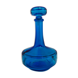 Bottle of old perfume of blue color