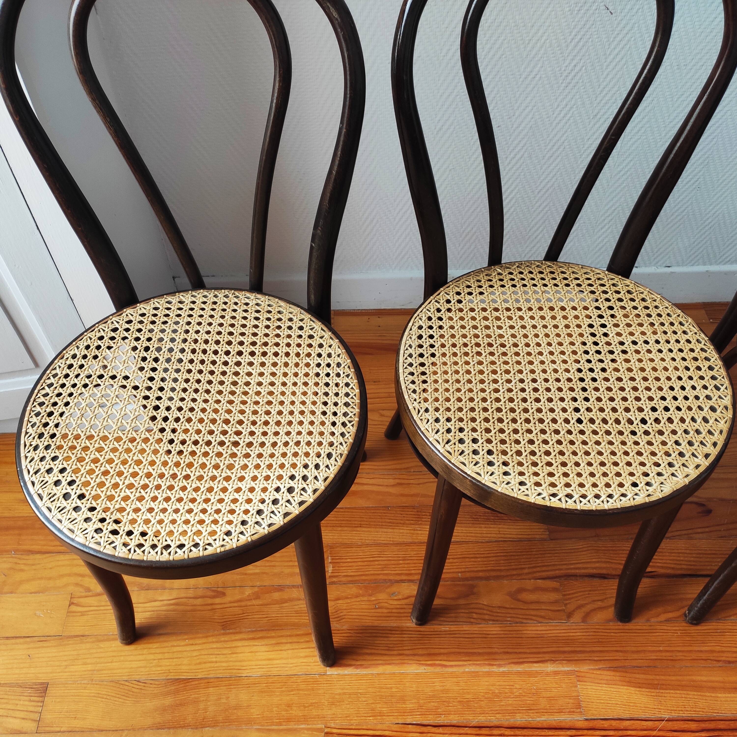 4 antique curved wood and cane chairs