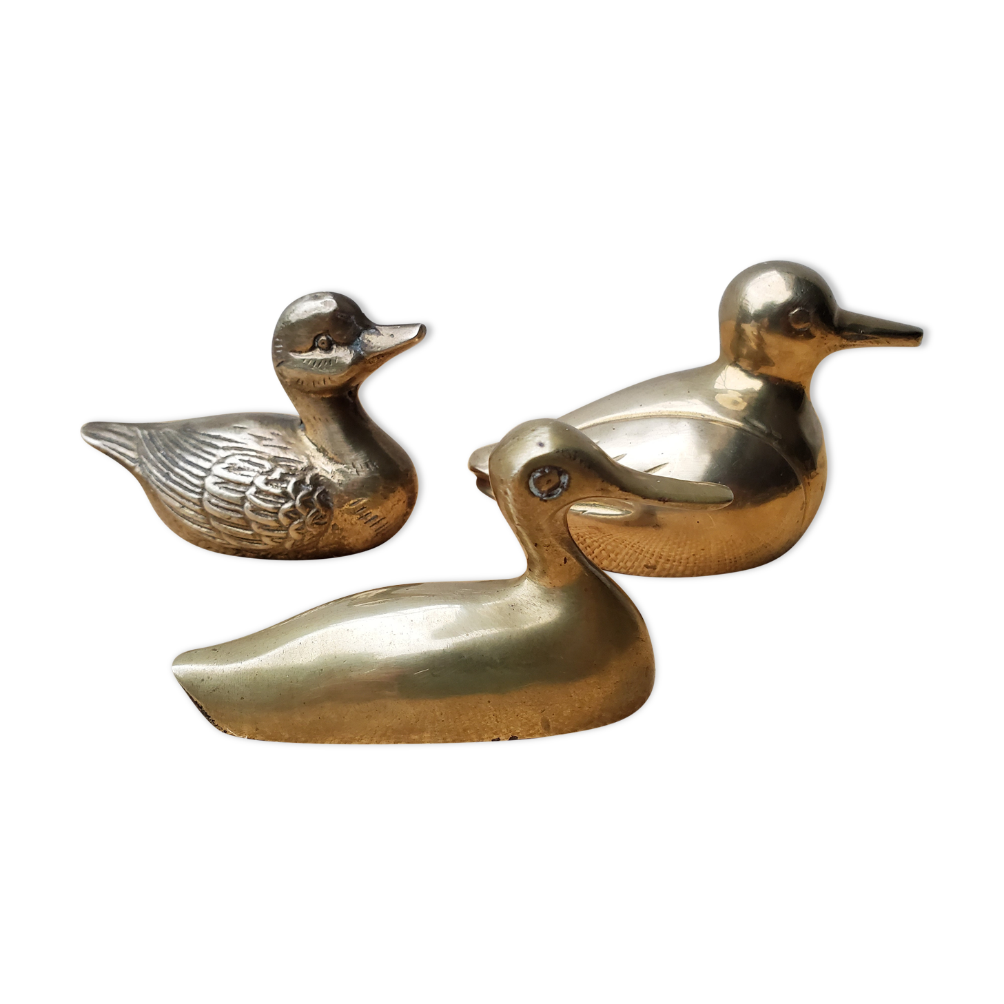 Trio of brass ducks