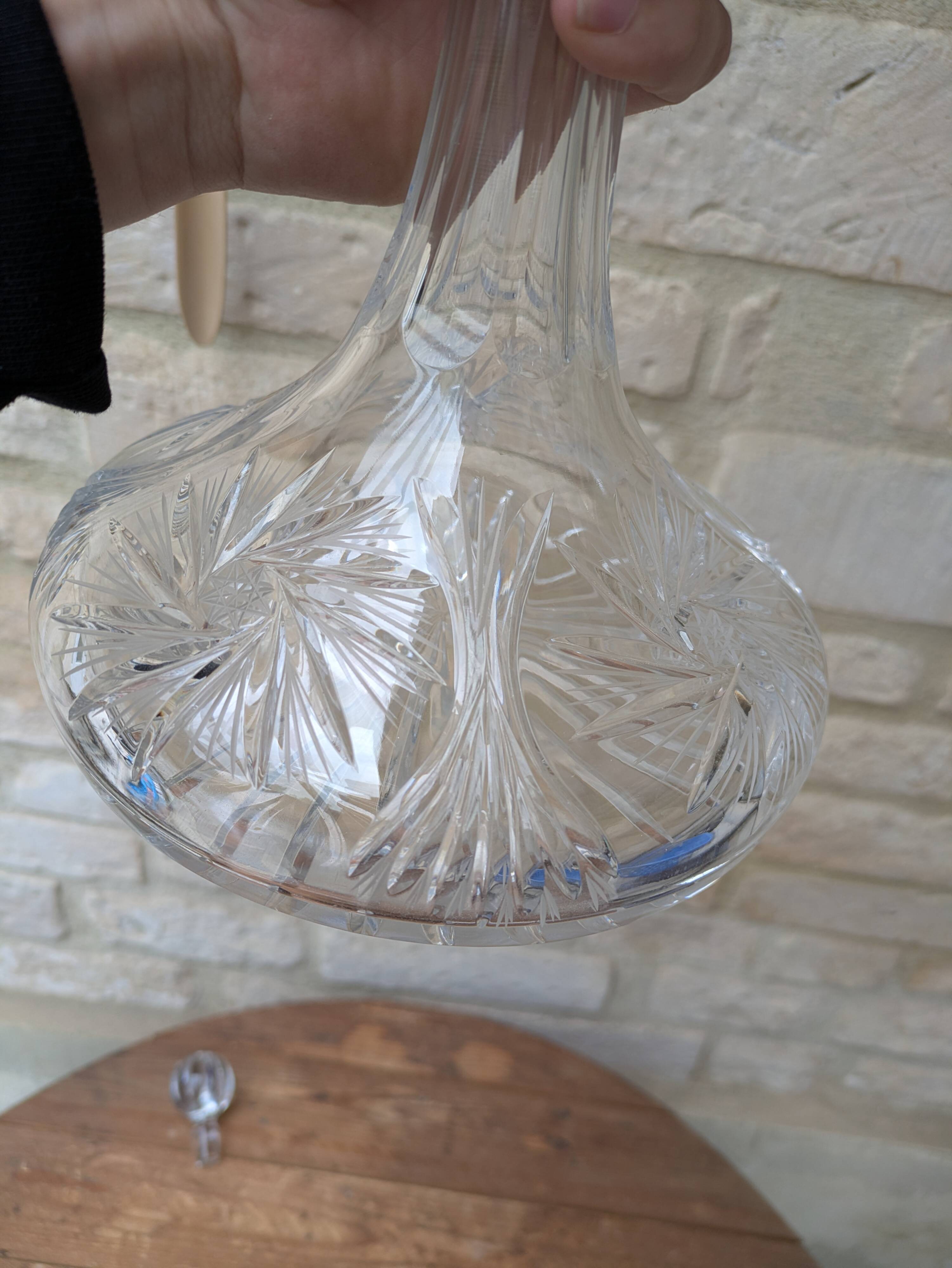 Antique cut crystal decanter with stopper.