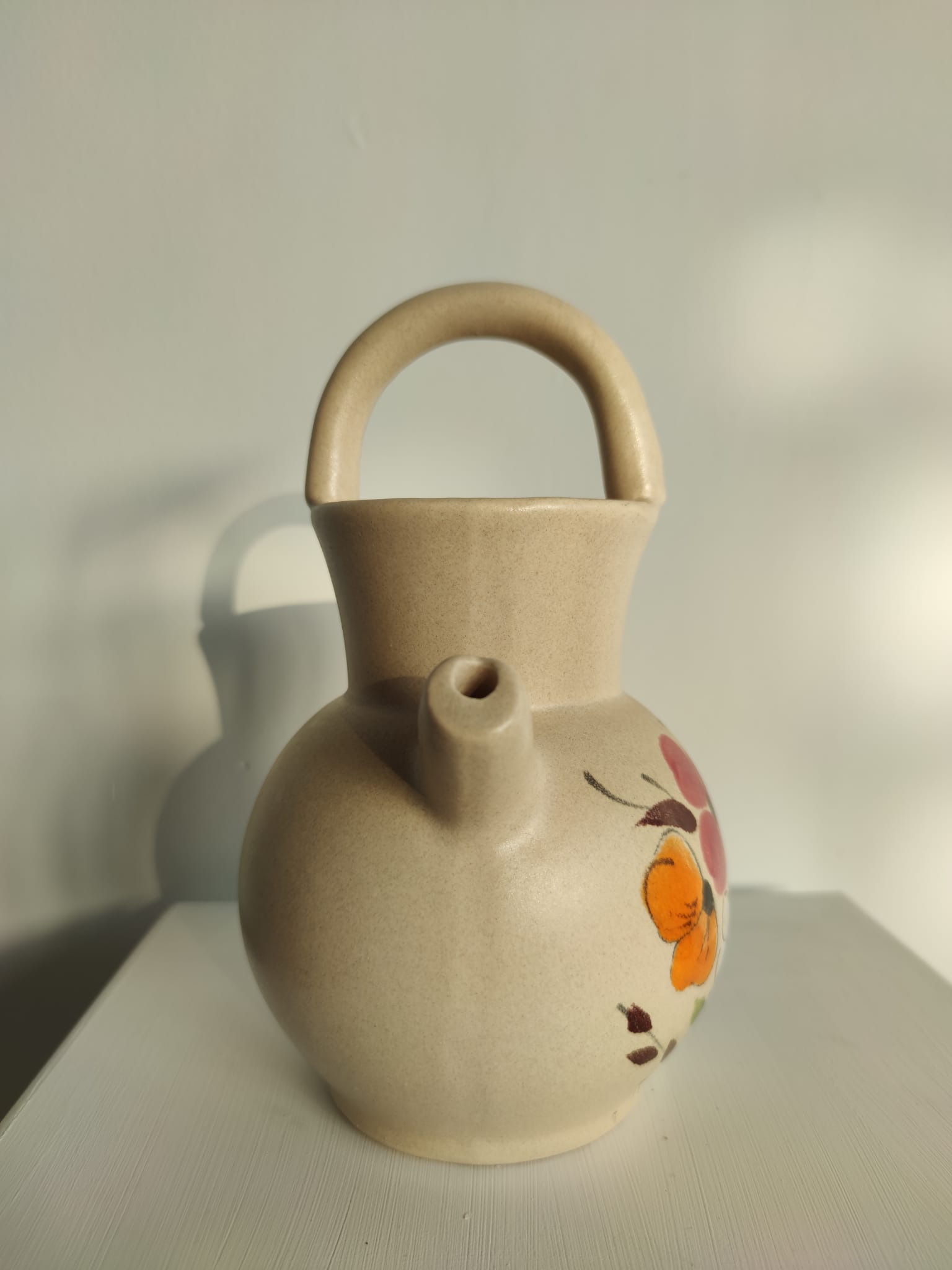 Pitcher ball in sandstone with floral pattern