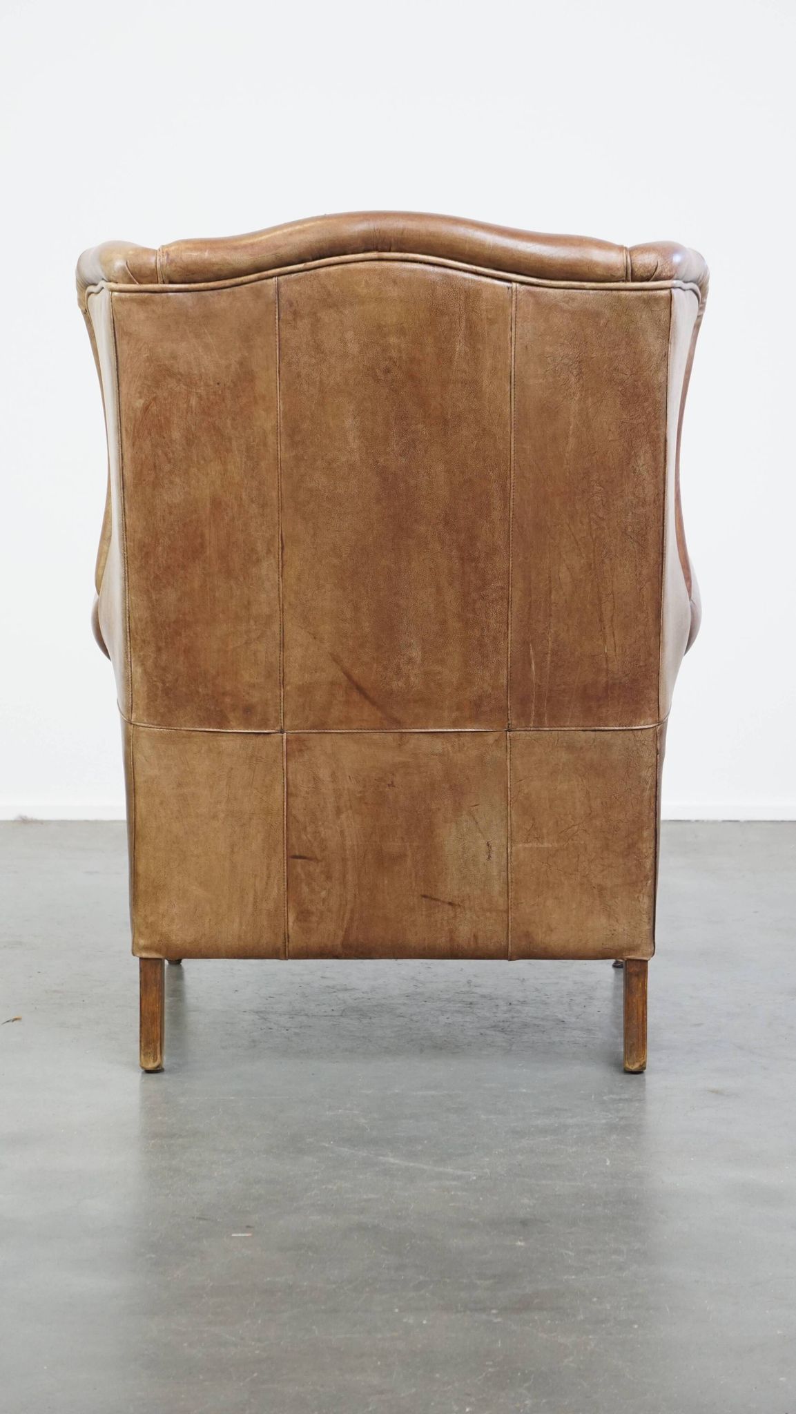 Cowhide Leather Wingback Chair in Light Cognac Color