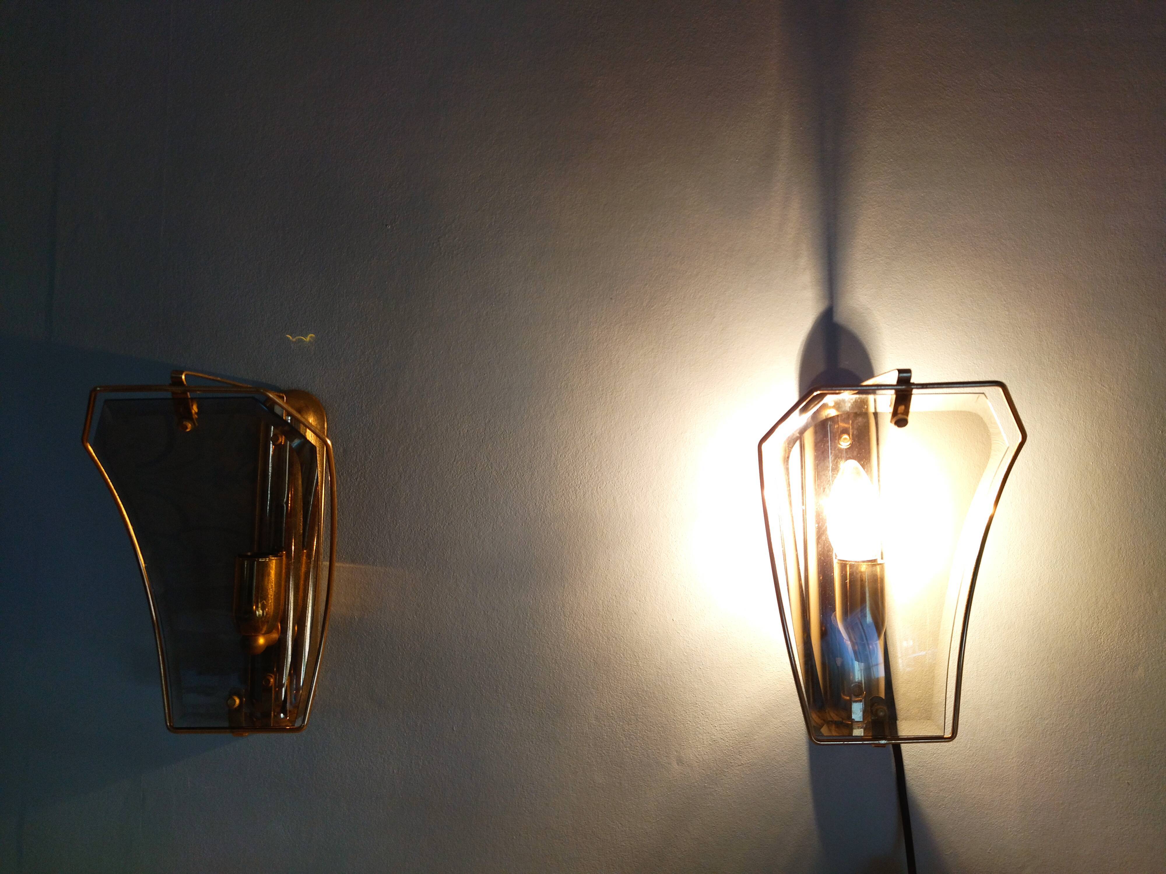 Pair of brass and curved glass wall lamps from the 80s