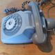 Old vintage wired dial phone with its earphone, gray color. Late 70s - early